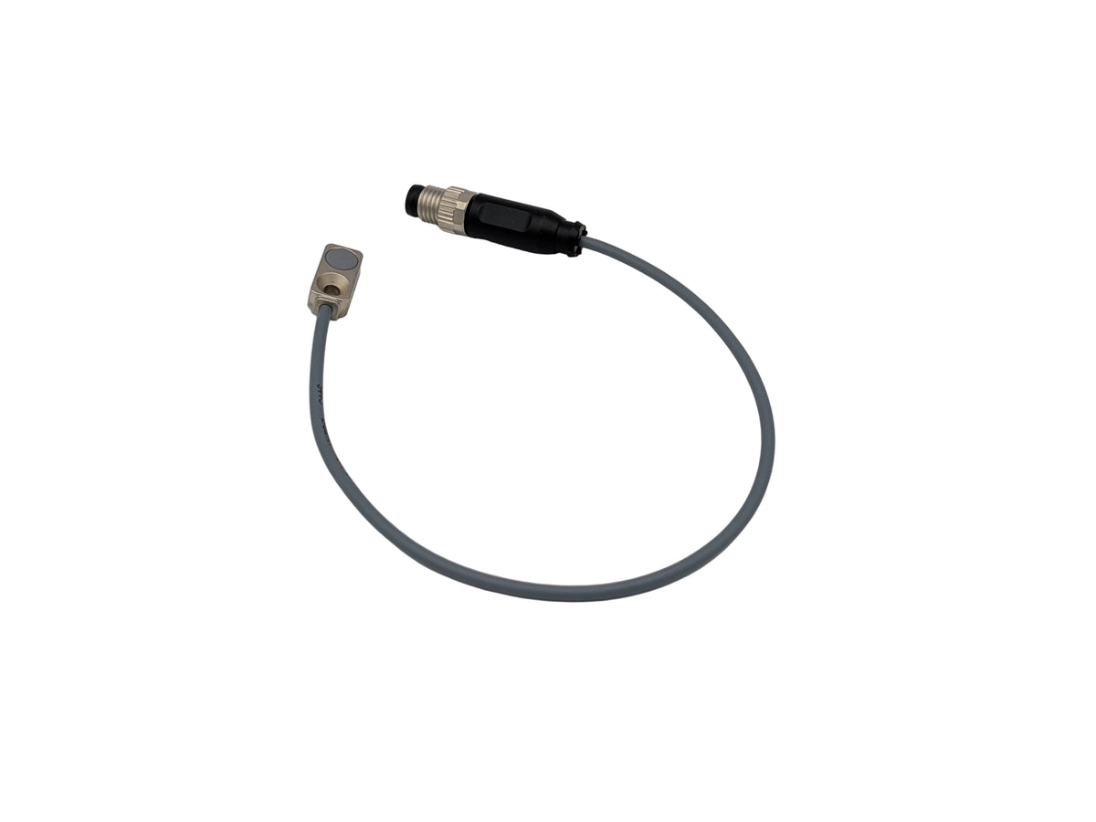 Coiled sensor cable with connectors on a white background