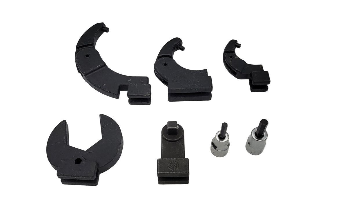 Set of black and silver torque wrench components on a white background