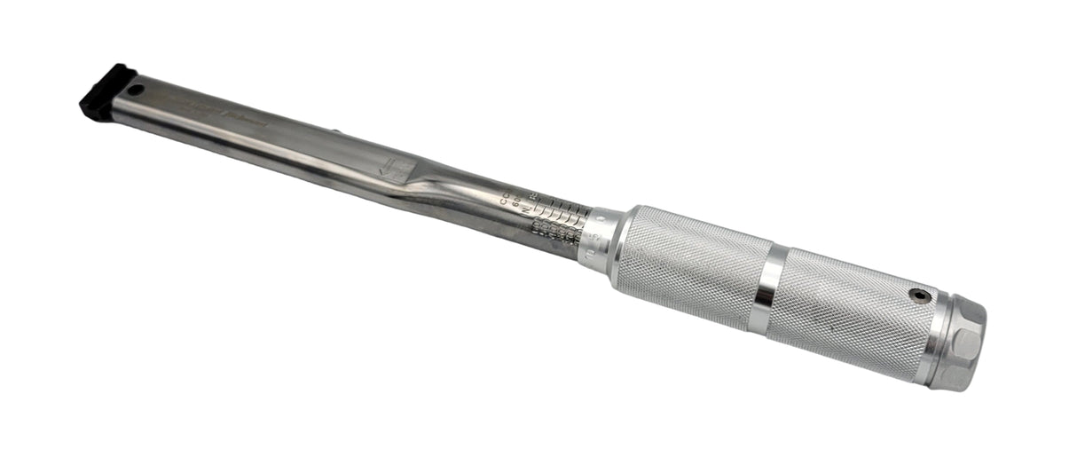 Metal tool with a cylindrical handle and metallic finish on a light gray background