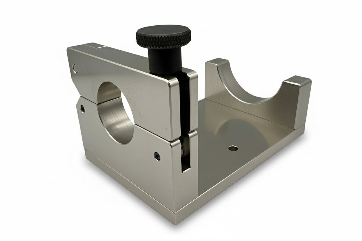 Metal tool with a knob on a gray background