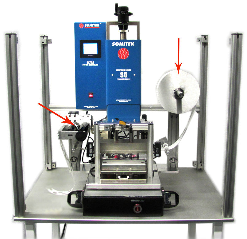 Film feeder on heat staking machine