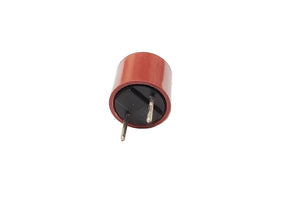 A red heat board fuse with two metal pins (electrodes).